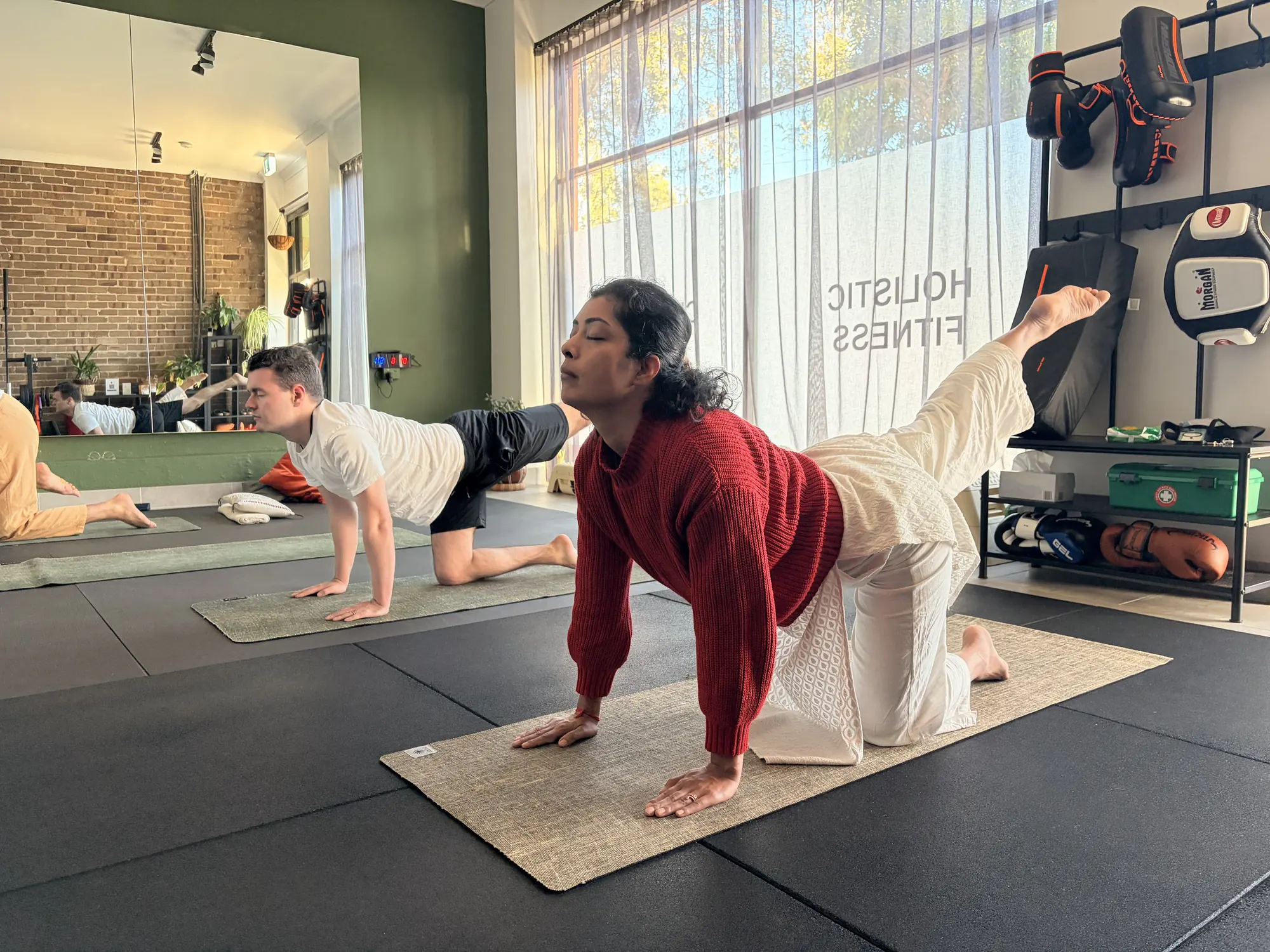 Dynamic yoga-based Angamardhana practice at Adiyoga in Earlwood