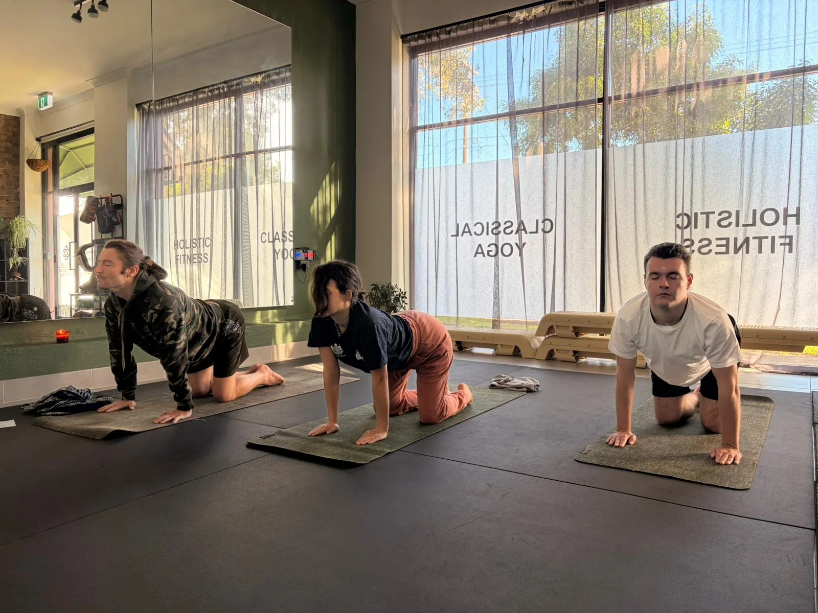 Beginner student learning a classical yoga posture at Adiyoga Earlwood